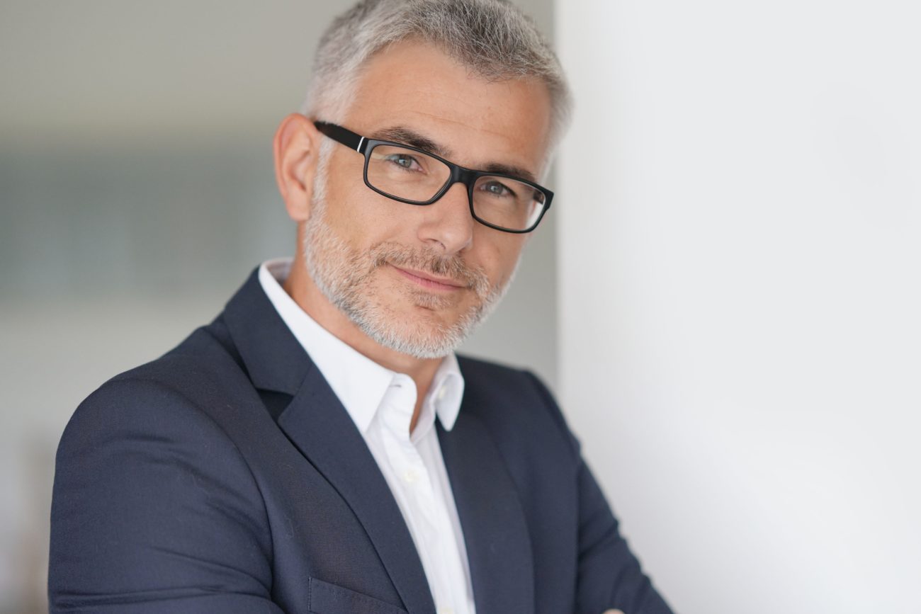 Businessman in grey suit, isolated